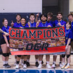 Image of a Laurier sports team holding a champions banner