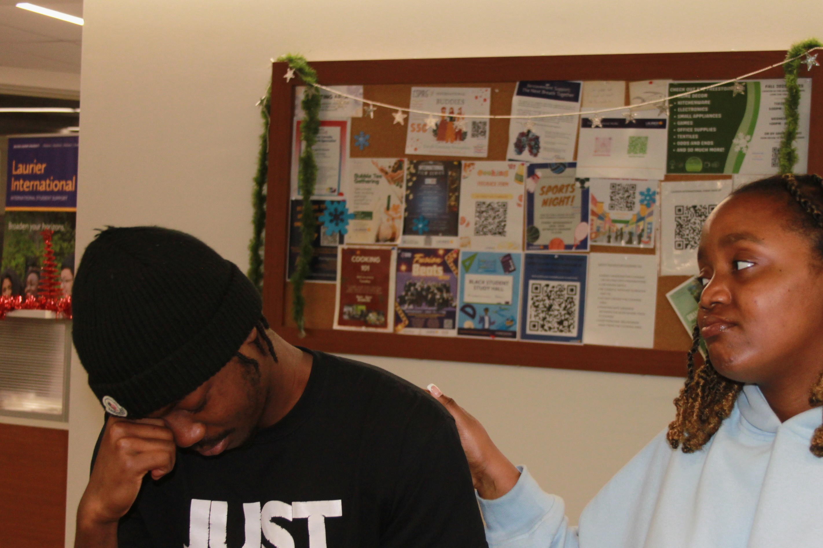 Image depicting someone comforting a friend